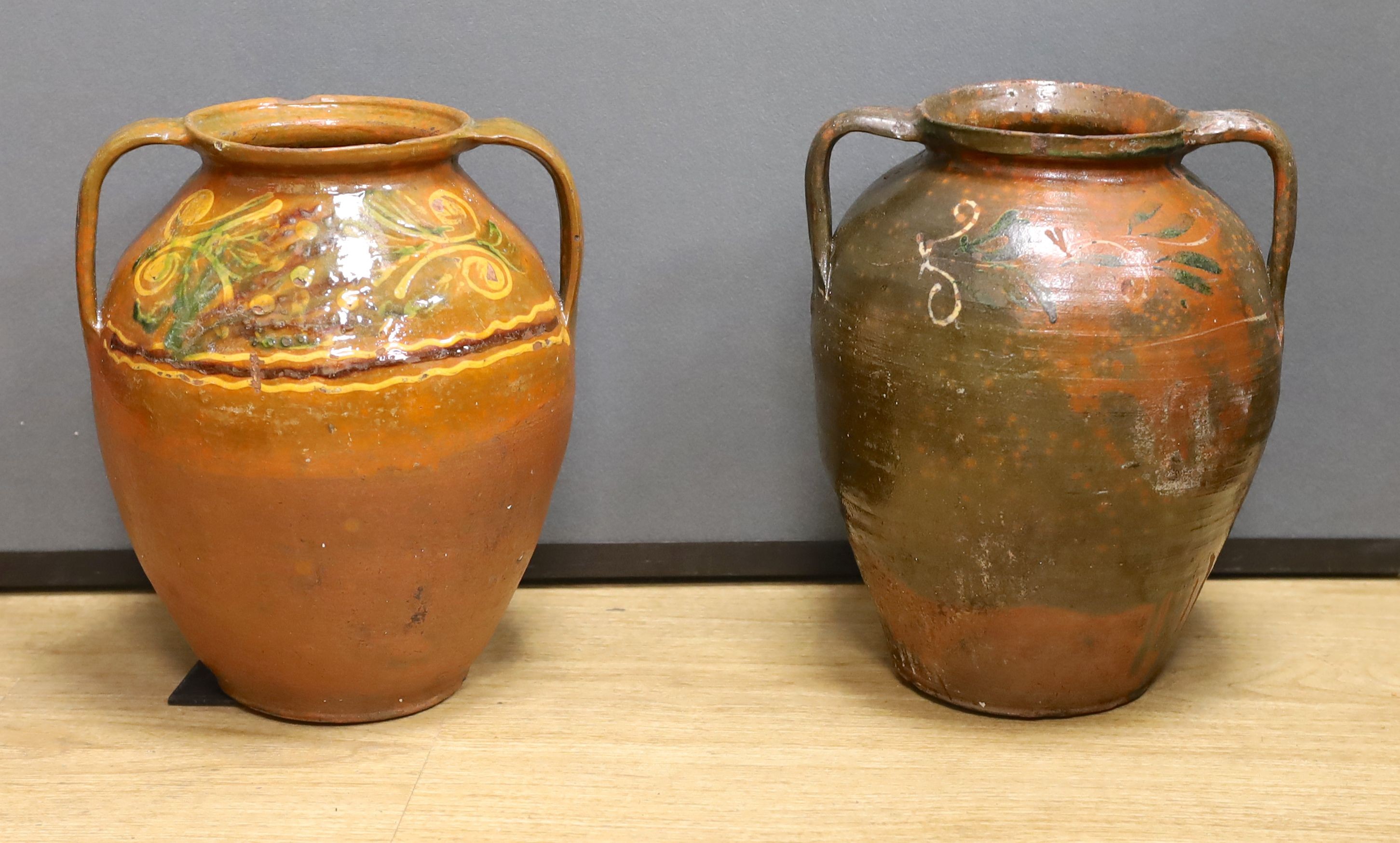 Two 19th century Continental Europe pottery urns - 35cm high